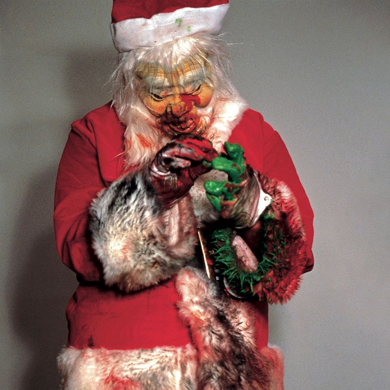 dishevelled Santa Claus covered in food an dirt