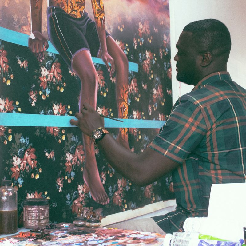 Patrick Quarm finishing a large painting in his studio