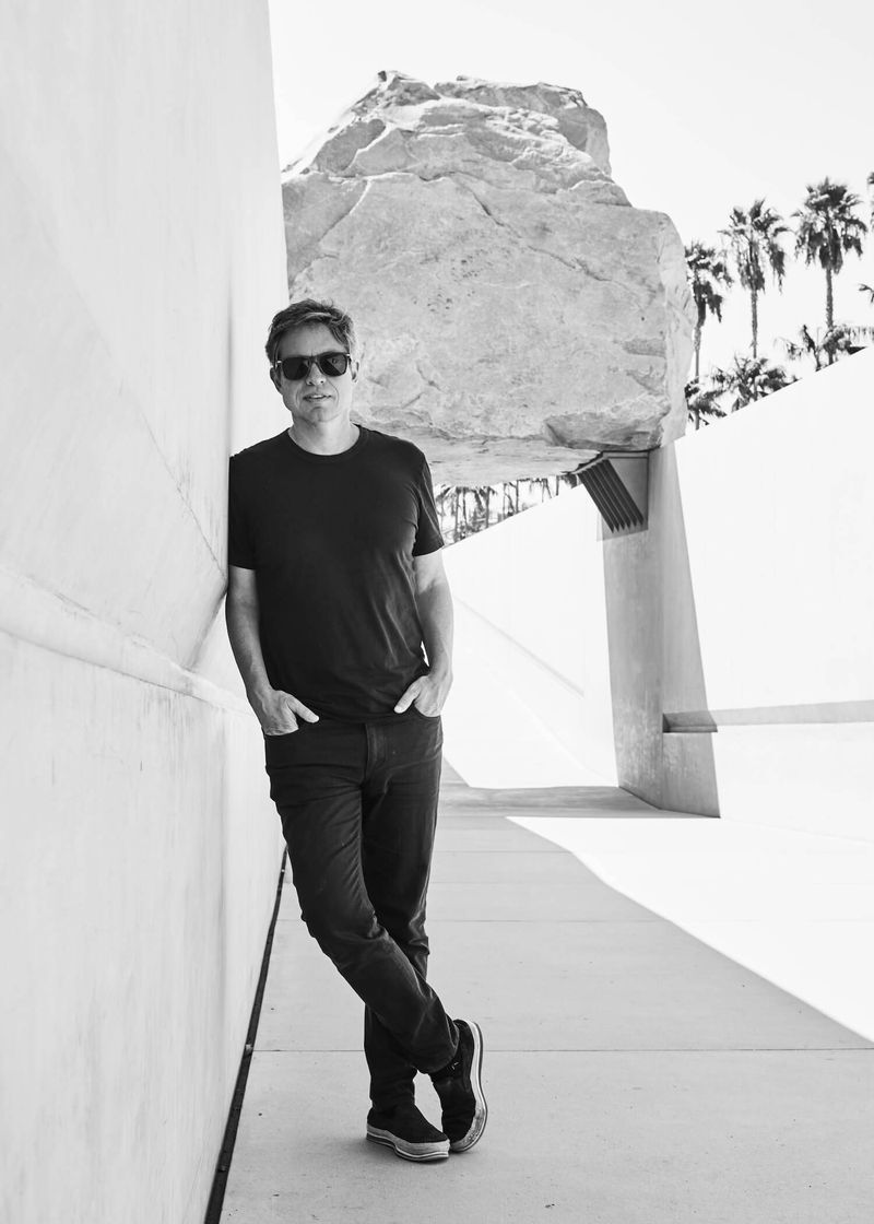 A man standing in sunglasses and black t-shirt, Nicolas Berggruen
