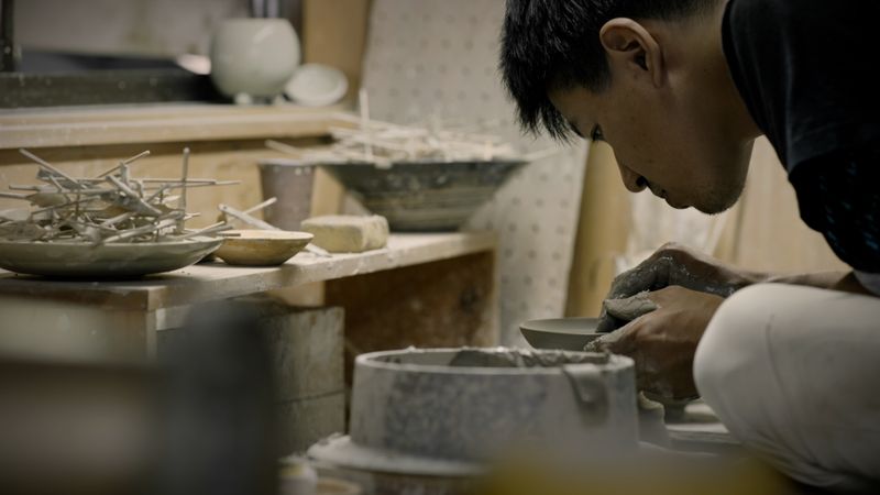 a local artist in Shigaraki working into clay