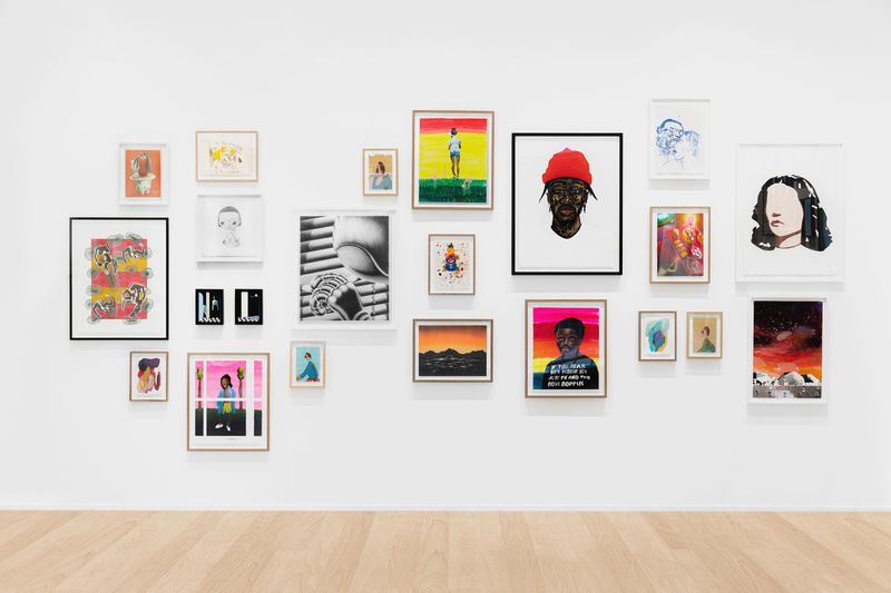 A wall with framed artworks, Exhibition shot WOAW Gallery & Avant Arte