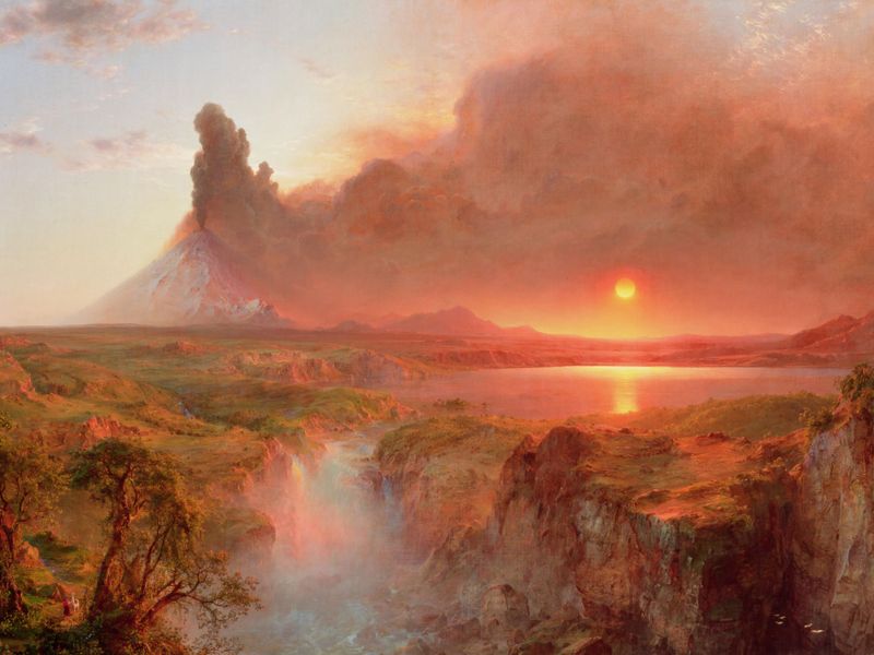 volcano erupting over luscious landscape