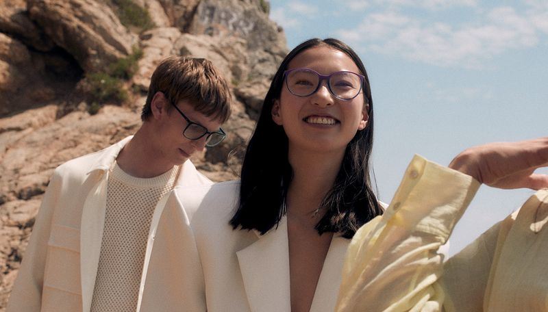 group of people wearing full-rim glasses at the beach