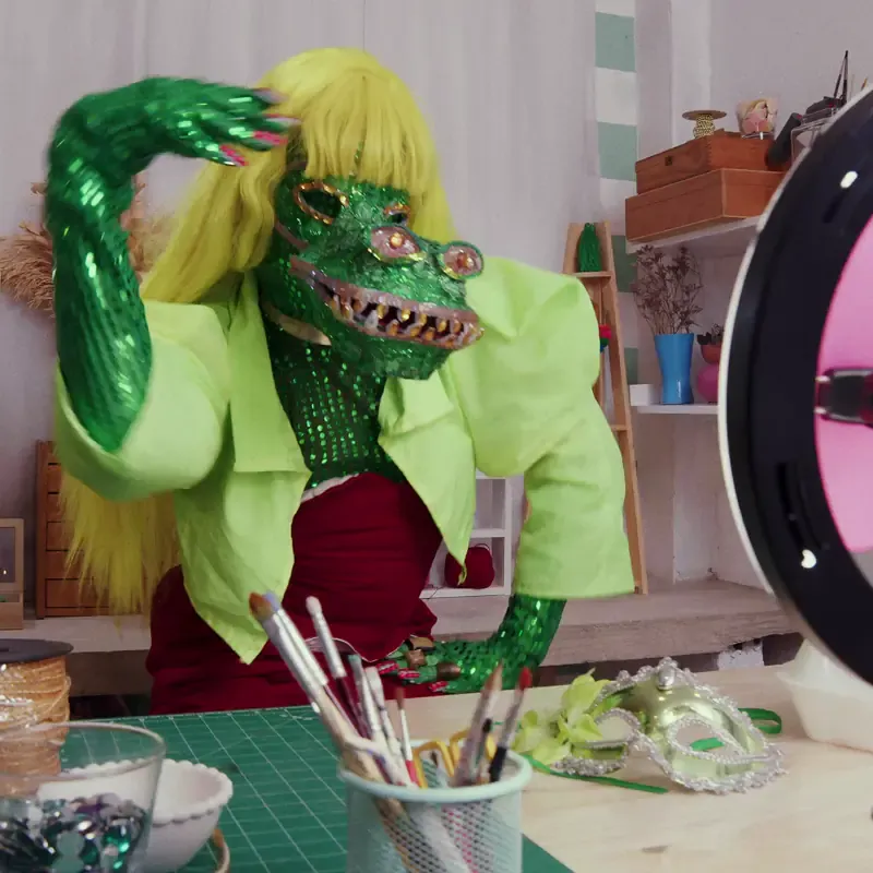 TikTok creator in a handmade costume in a craft studio