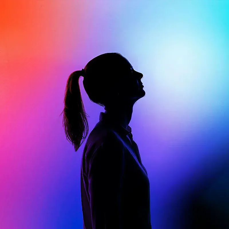 Colourful gradient with a woman silhouette listening, hero of the QSIC case study