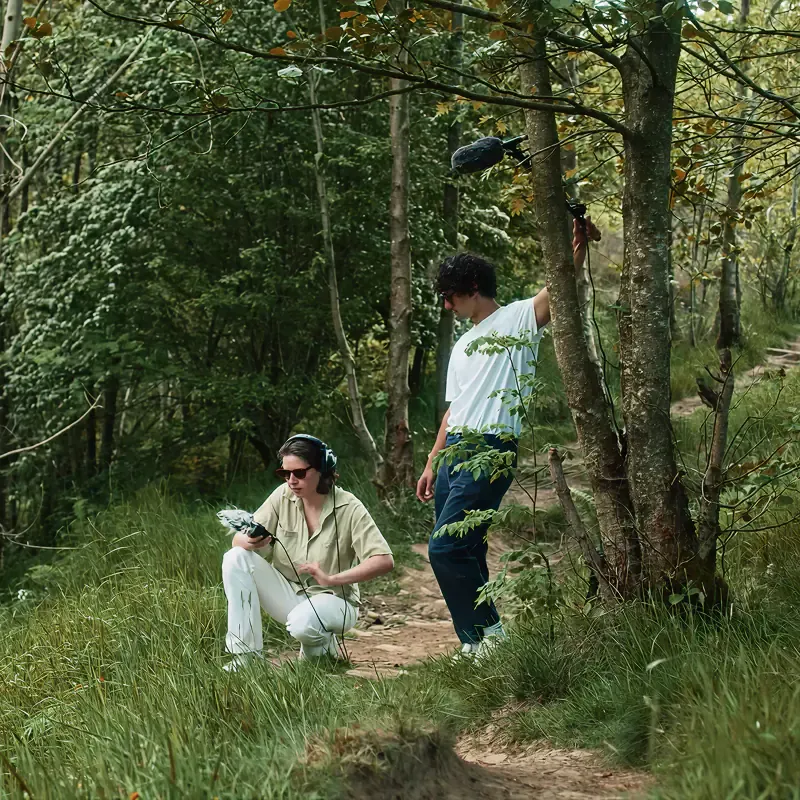 Sound recordists capturing audio in green woodland, from MassiveMusic's Sound of National Trust campaign