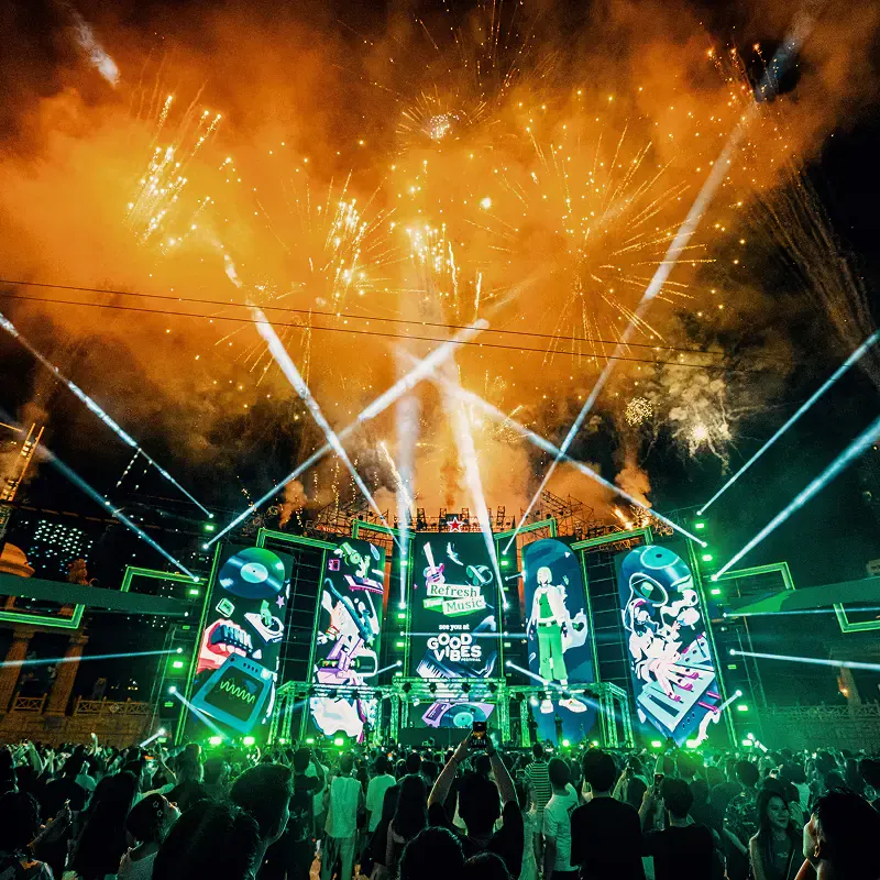 Square hero of a Heineken music experience activation event with vibrant stage lighting and crowd