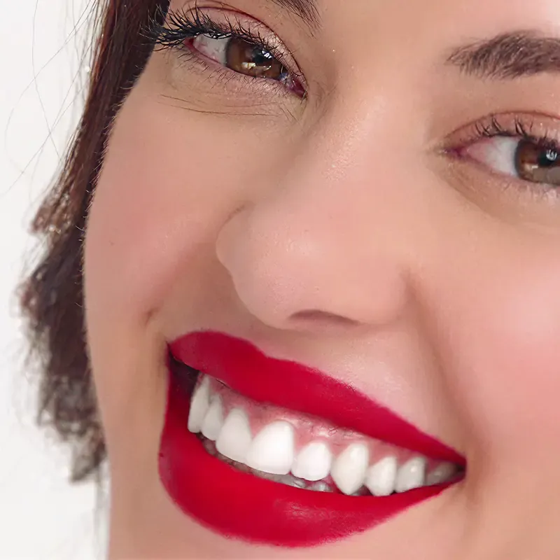 Woman with red lips and a white smile, from the Sound of Colgate campaign