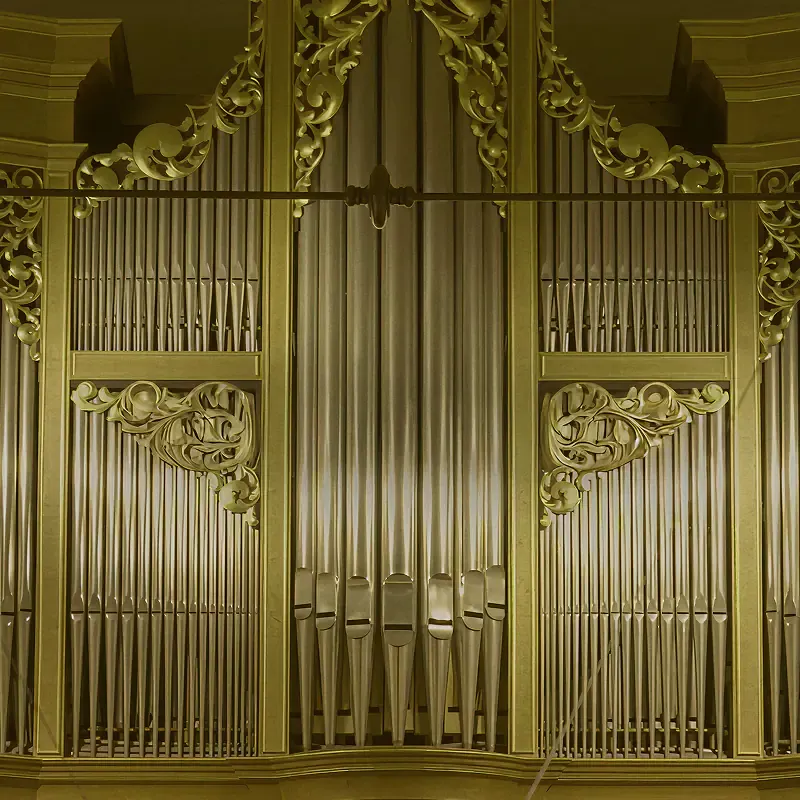 Golden pipe organ in an abbey, square image from the Sound of Leffe campaign