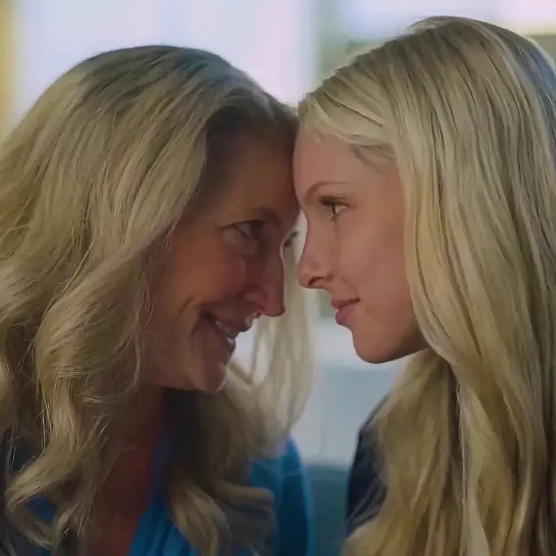 Mother and daughter touching foreheads and smiling, from Dove's Cost of Beauty film