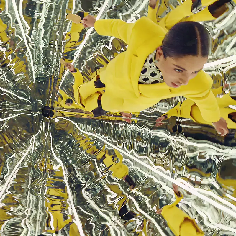 Woman in a yellow dress with silver foil, from the Sound of Magnum campaign