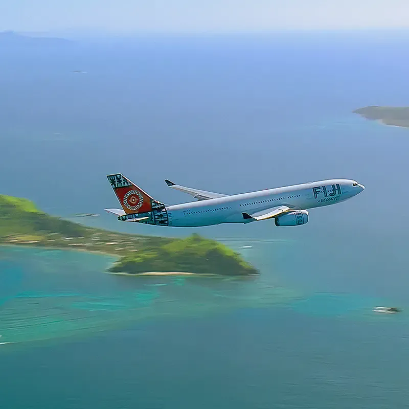 Fiji Airways aircraft flying above tropical islands and ocean, from the Sound of Fiji Airways campaign