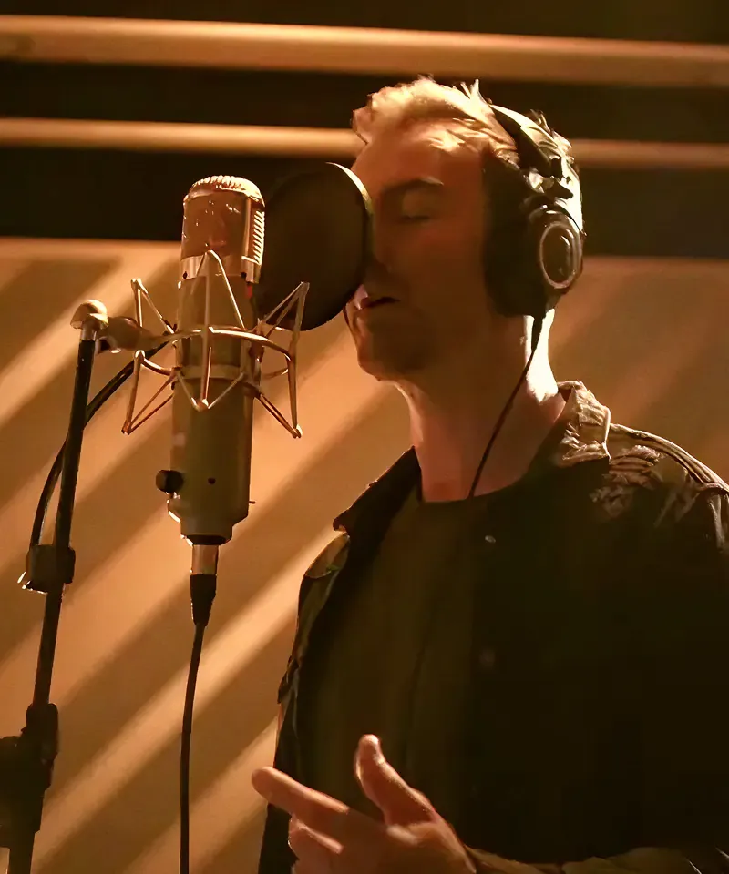 Male vocalist recording at a studio condenser microphone, from the Sound of Samsung campaign