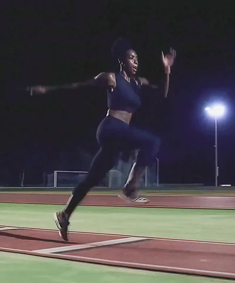 Female sprinter running on a track at night, from the Sound of Samsung campaign