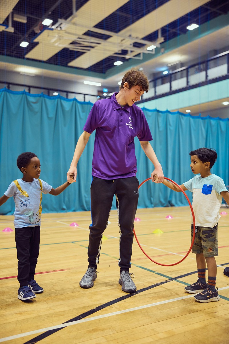 JAG staff and children playing in sports hall