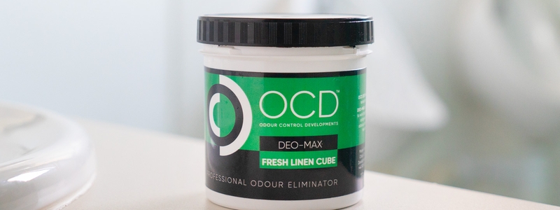 green ocd odour neutraliser cube tub in a bathroom