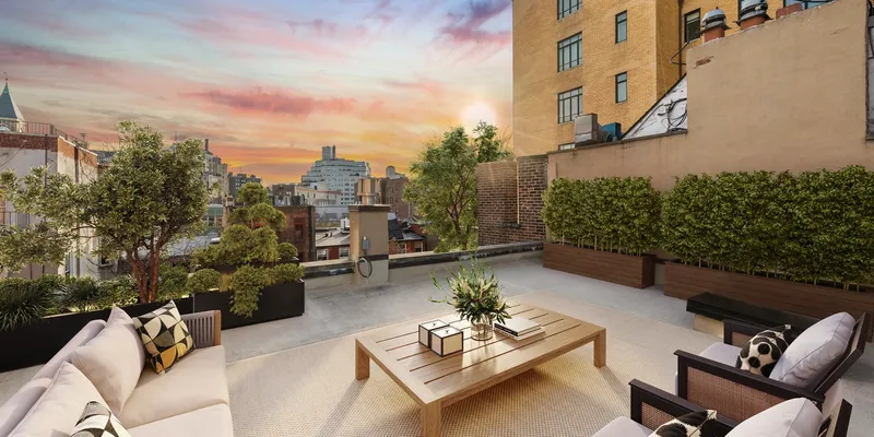 NYC West Village townhouse terrace with table and furniture overlooking buildings