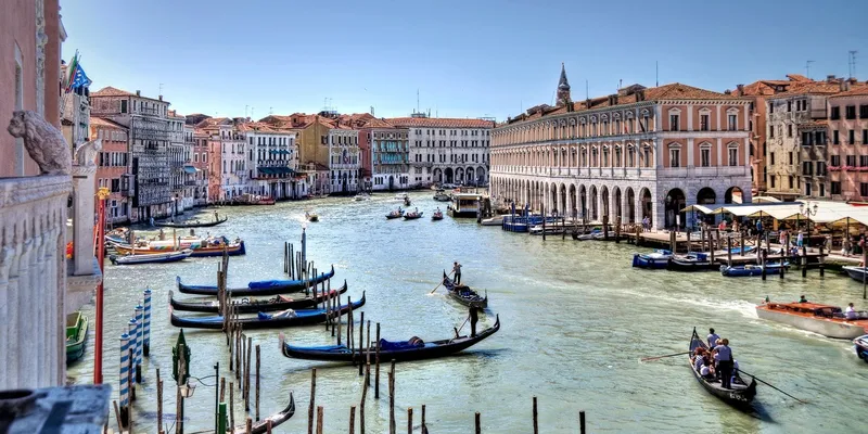 Venice Grand Canal with gondolas and boats sailing 