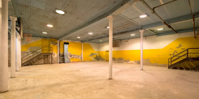 Underground gymnasium in Bushwick with white and yellow walls