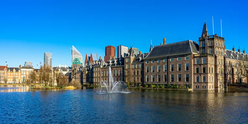 Binnenhof in The Hague with fountain and skyscrapers in the background