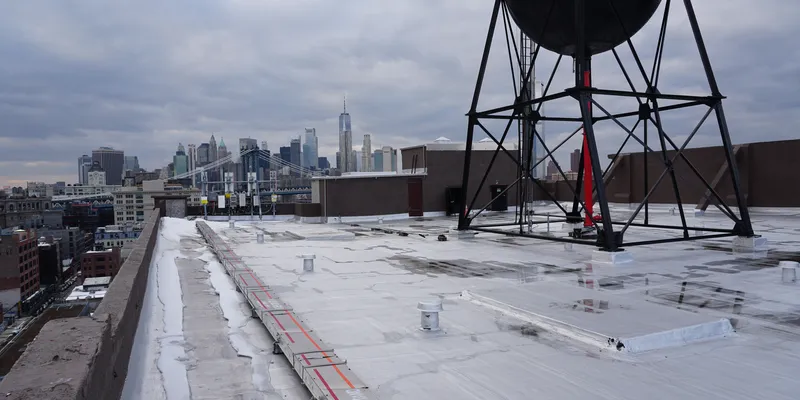 Vinegar Hill rooftop in NYC overlooking Manhattan skyline