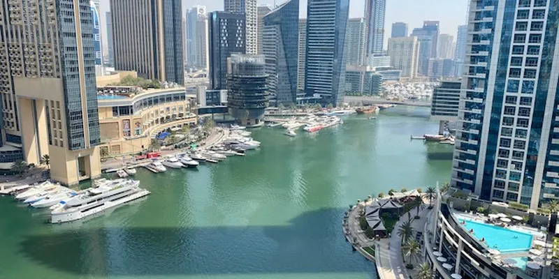 Dubai Marina skyline with boats on the water
