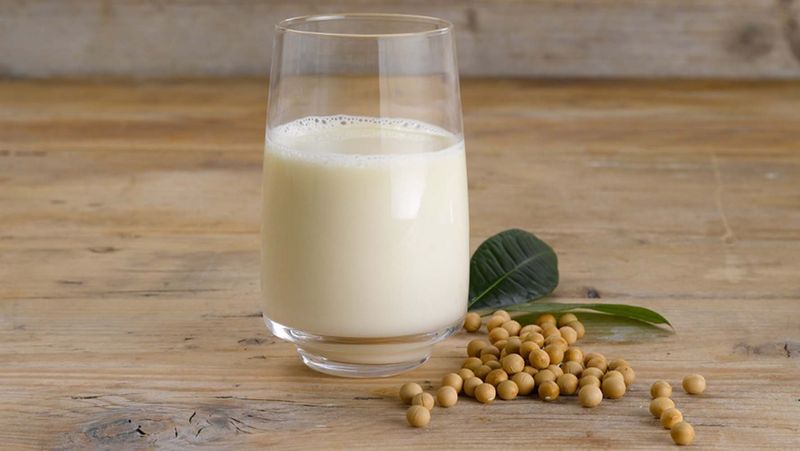 Glass of soya milk with soya beans 