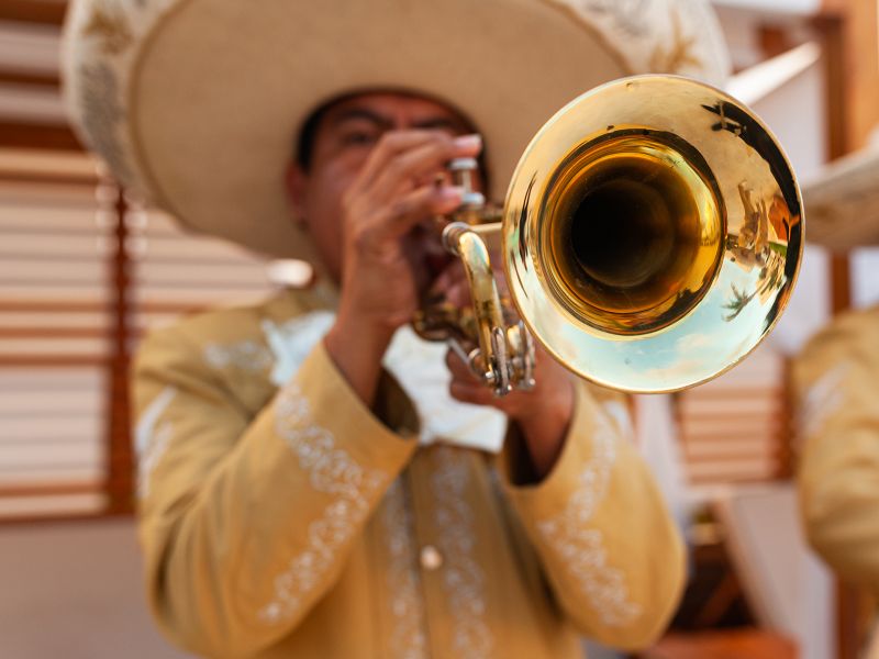 A mariachi band member playing the trumpet in Mexico
