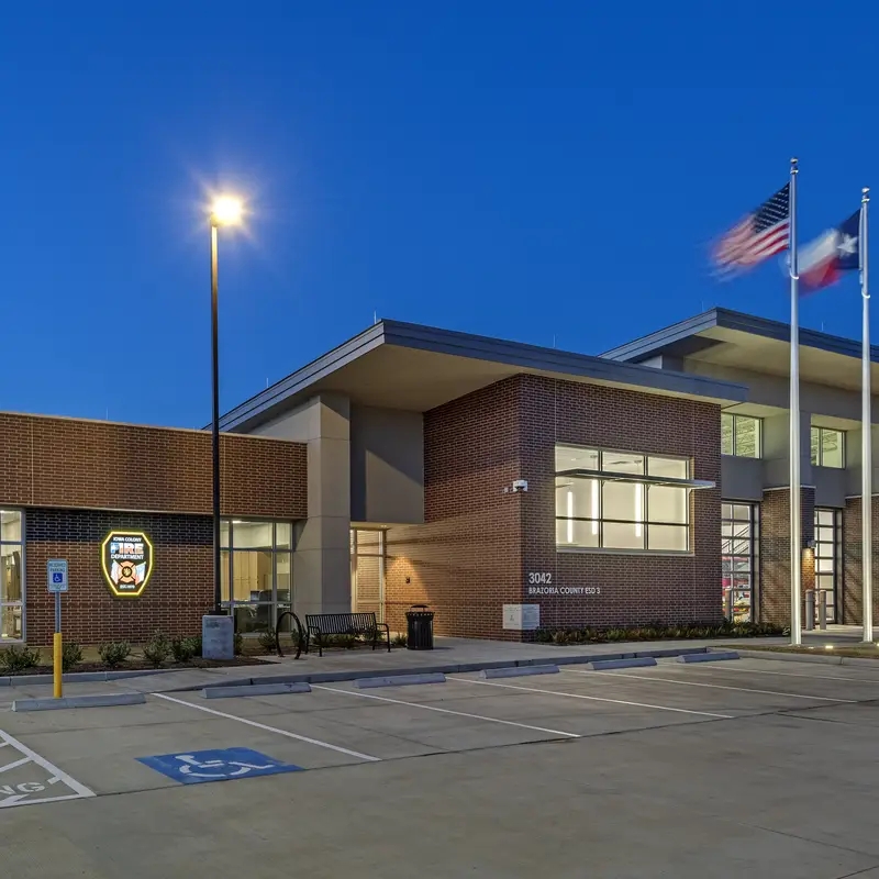Cylinders between apparatus doors – Contech #CYL6
Flag uplights – LSI #XIG
Site pole – LSI #SLM (Slice)
Cylinder pendants thru window – Scott Architectural #S2874 (Cyla)
