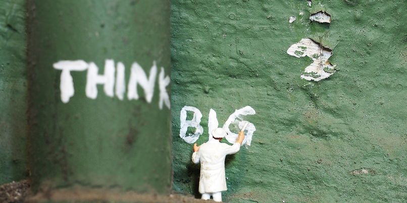 'think big' painted on a wall