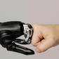 human and robotic hands fist bump