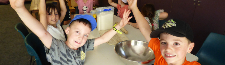 kids with their arms thrown in the air