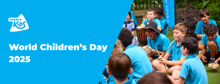 World children's day image of children wearing blue t-shirts and white sherpa kids logo
