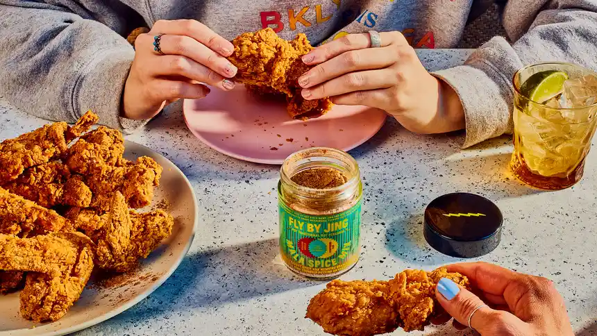 Overview image of people eating fried chicken with Mala Spice Mix on it