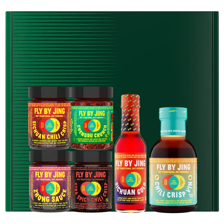 Product line up of Fly By Jing sauces with the box