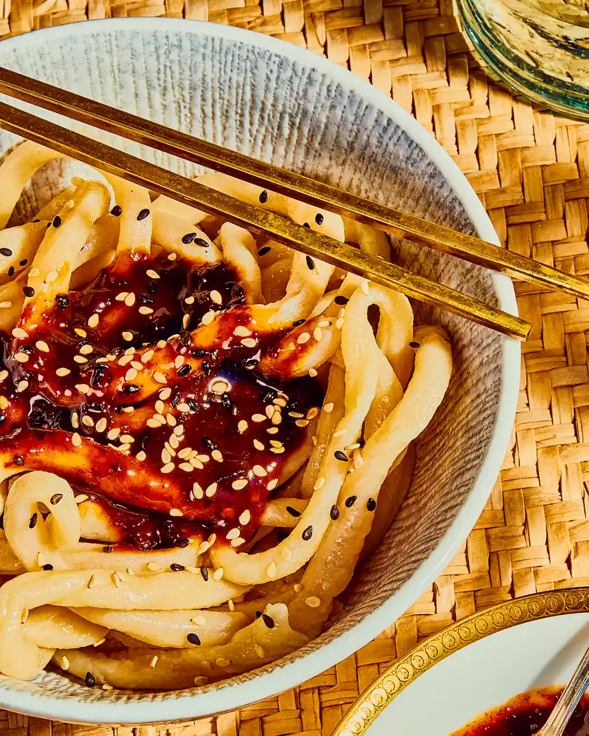 Zhong Sauce drizzled on top of a plate of noodles