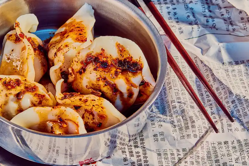 Image of dumplings in a bowl with Sichuan Chili Crisp on top