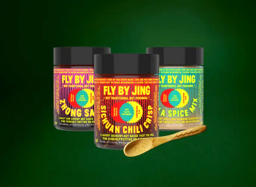 line up of Fly By Jing sauces on wooden blocks
