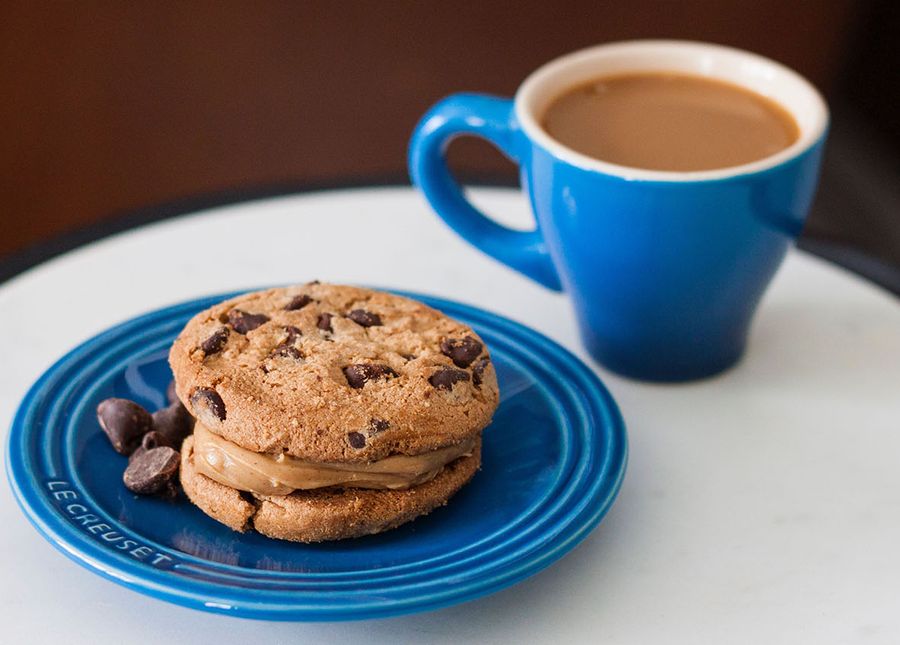 Is your loved one ready for care- photo of a blue coffee cup and bread plate. There are chocolate chip cookies on the plate