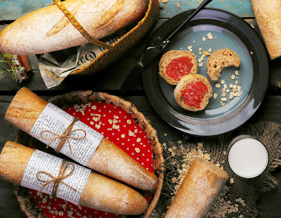 french baguettes with jam on a wooden table