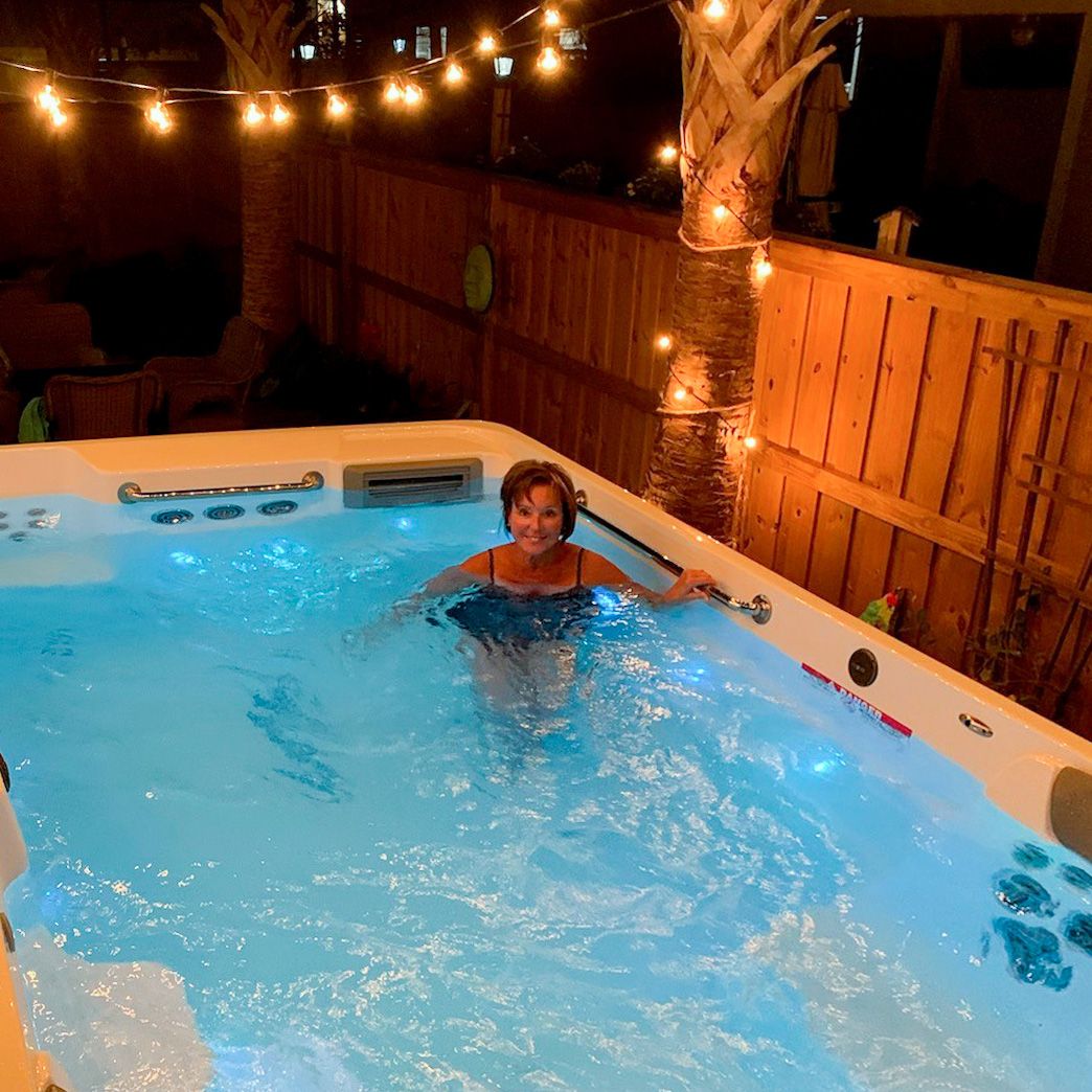 picture of woman relaxing in an Endless Pools R200 swim spa
