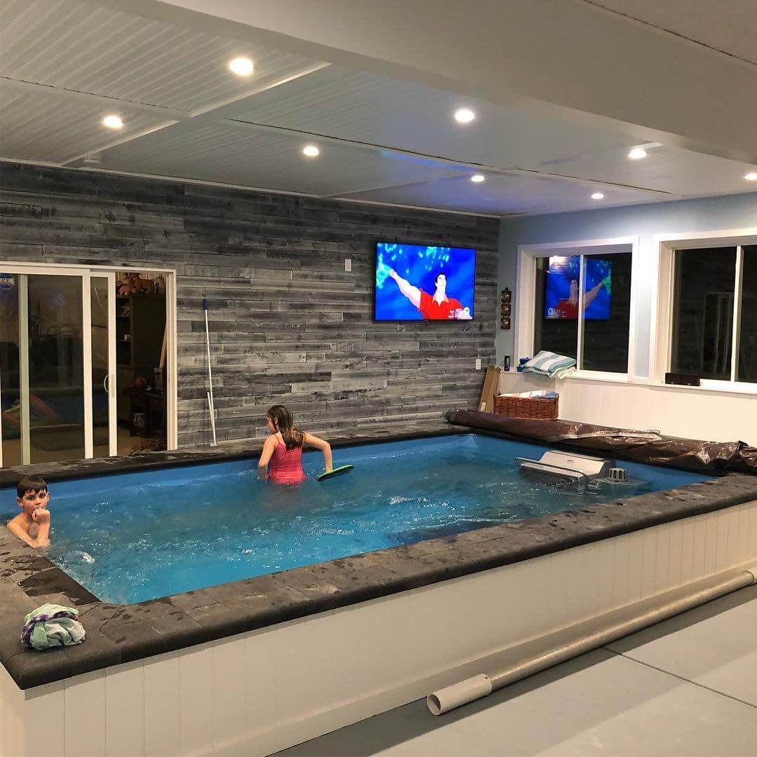 picture of Chris' kids playing in the Performance Endless Pool in their new pool room home addition