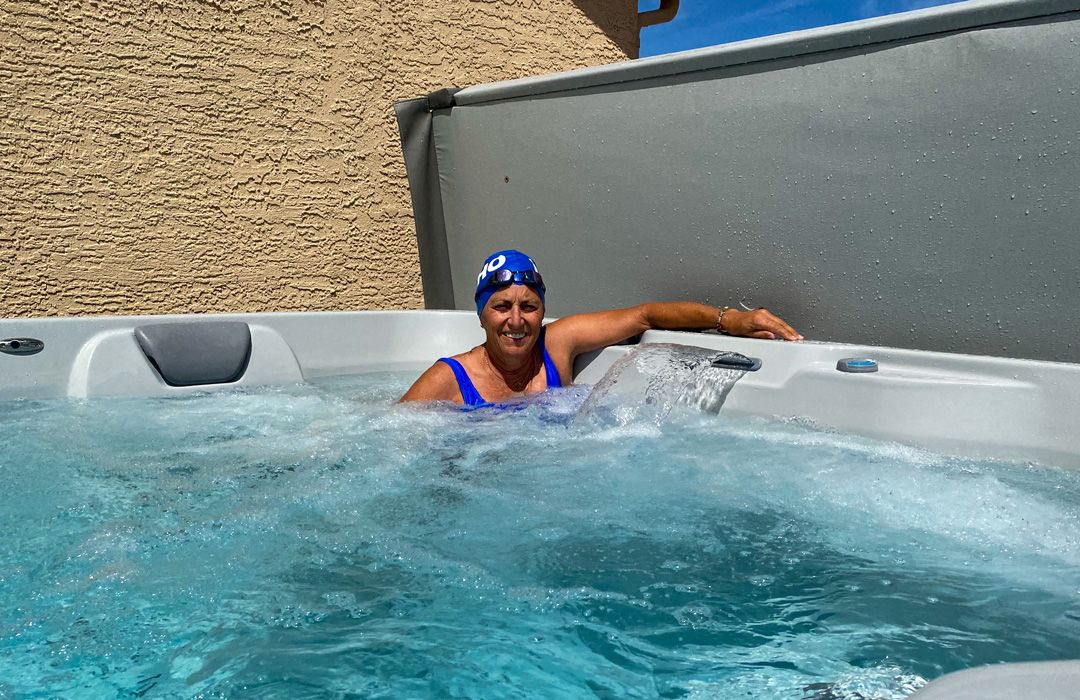 picture of Leona relaxing in her Endless Pools RecSport swim spa