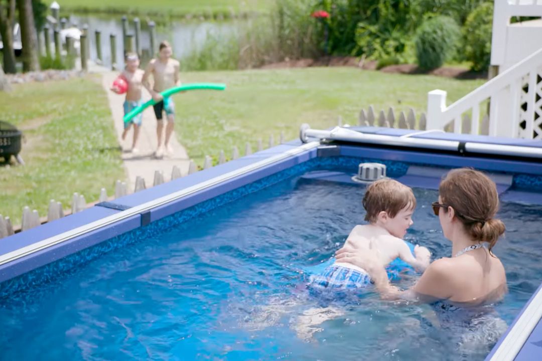 picture of mother teaching her son to swim in the Endless Pools Streamline pool