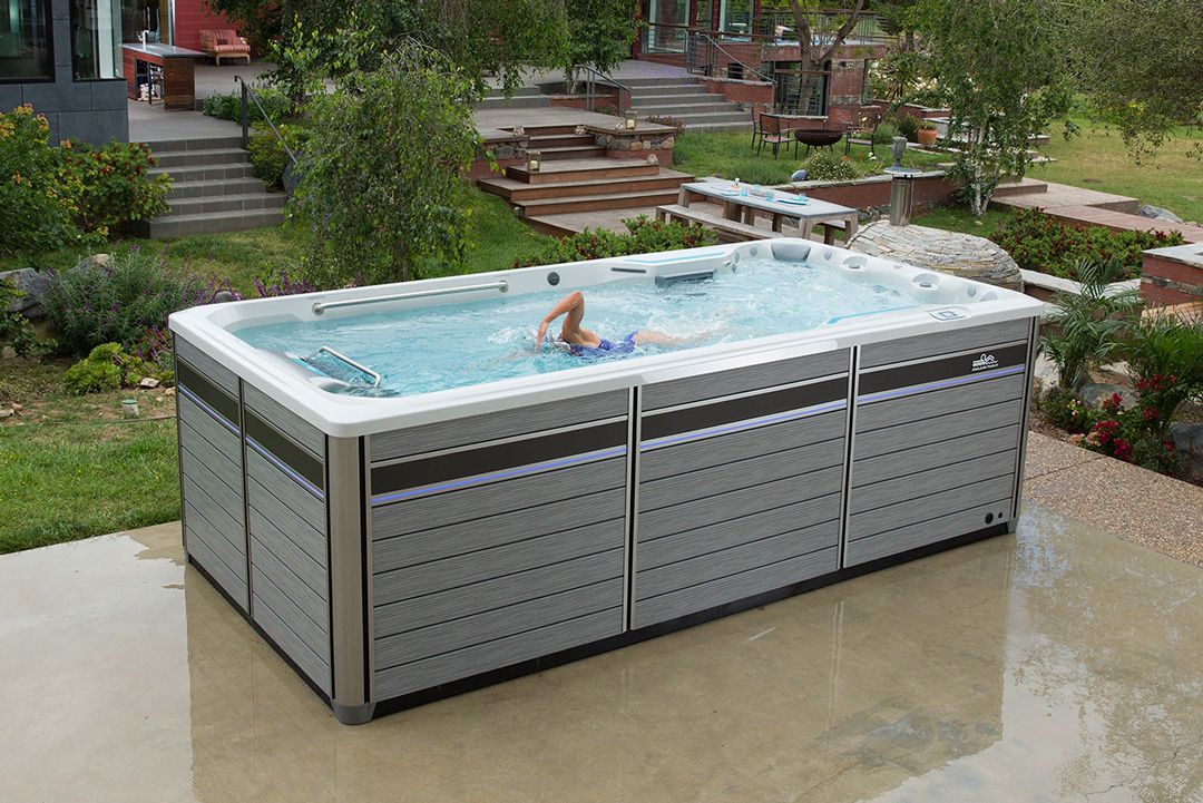 A picture of an Endless Pools Fitness System E500 swim spa installed as a patio pool