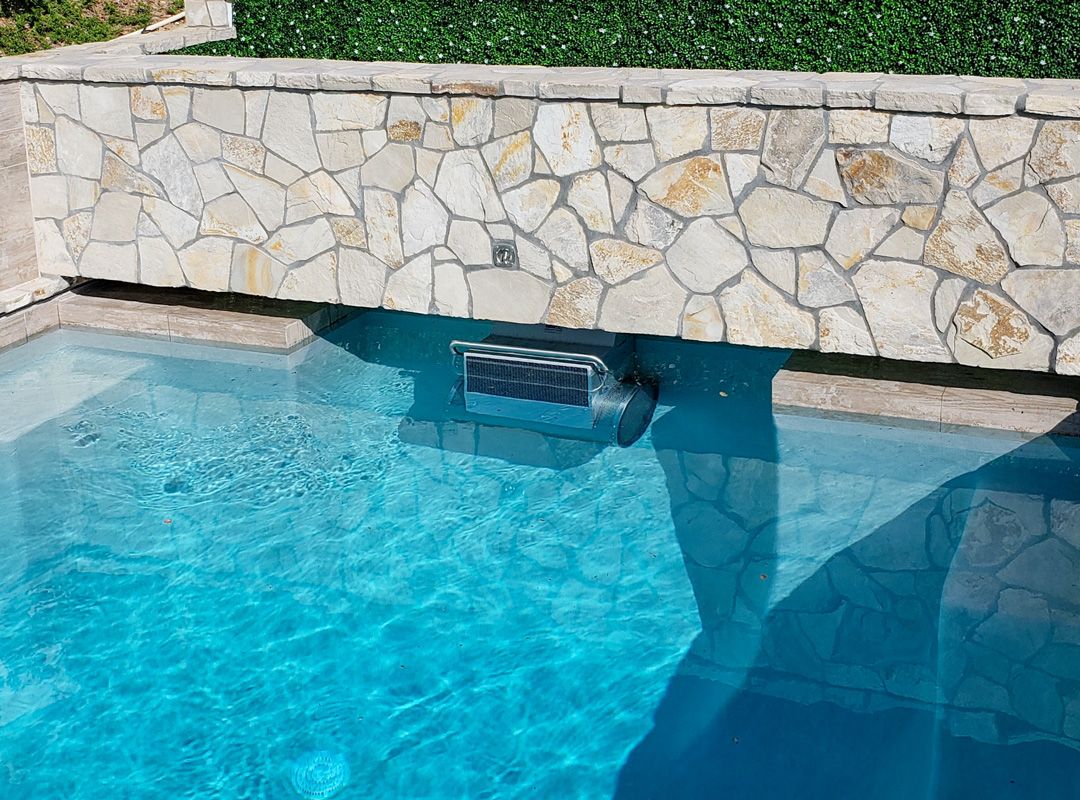 picture of pool with an Endless Pools Fastlane Pro system installed below the pool deck