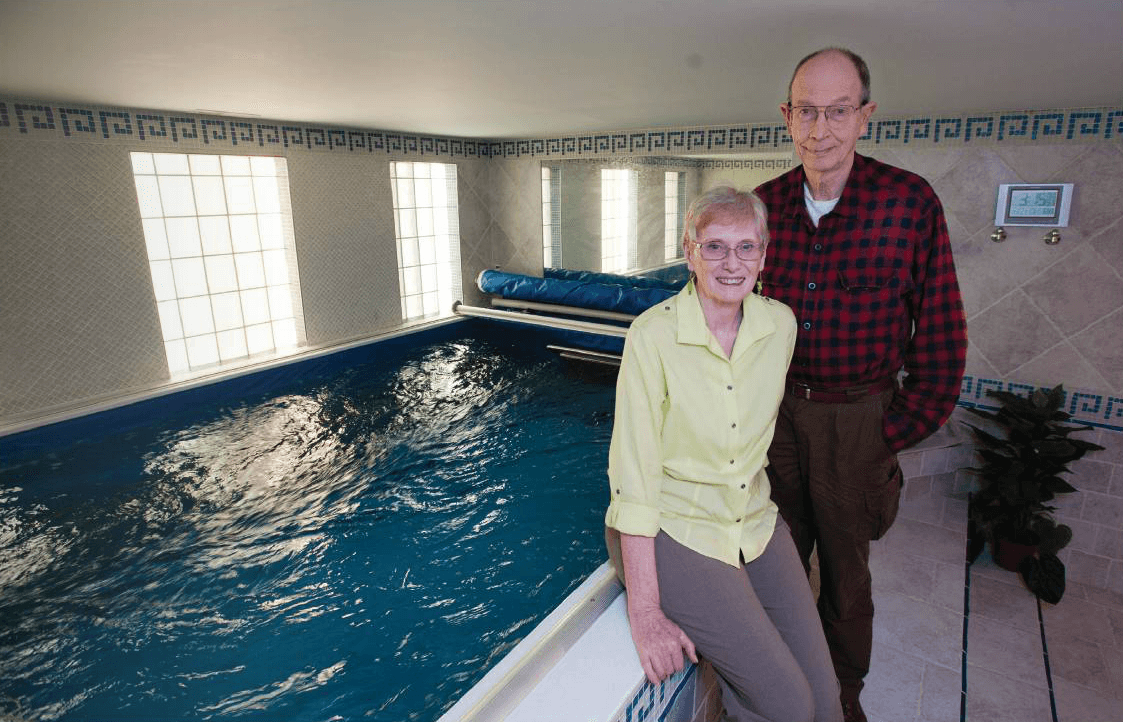 The Goetzes at home with their Endless Pools swimming machine