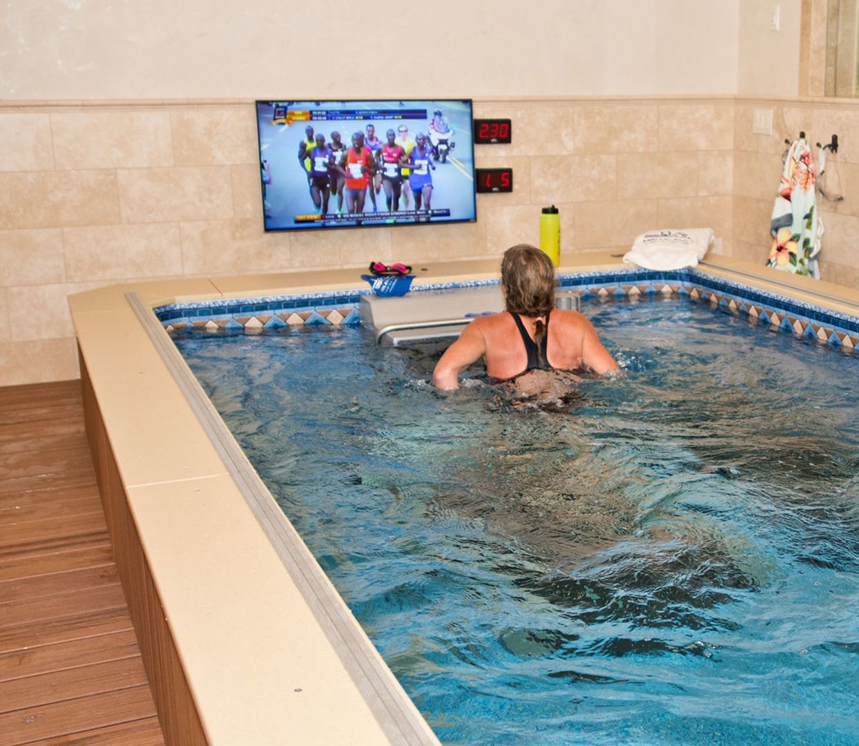Picture of a customer running on her Underwater Treadmill