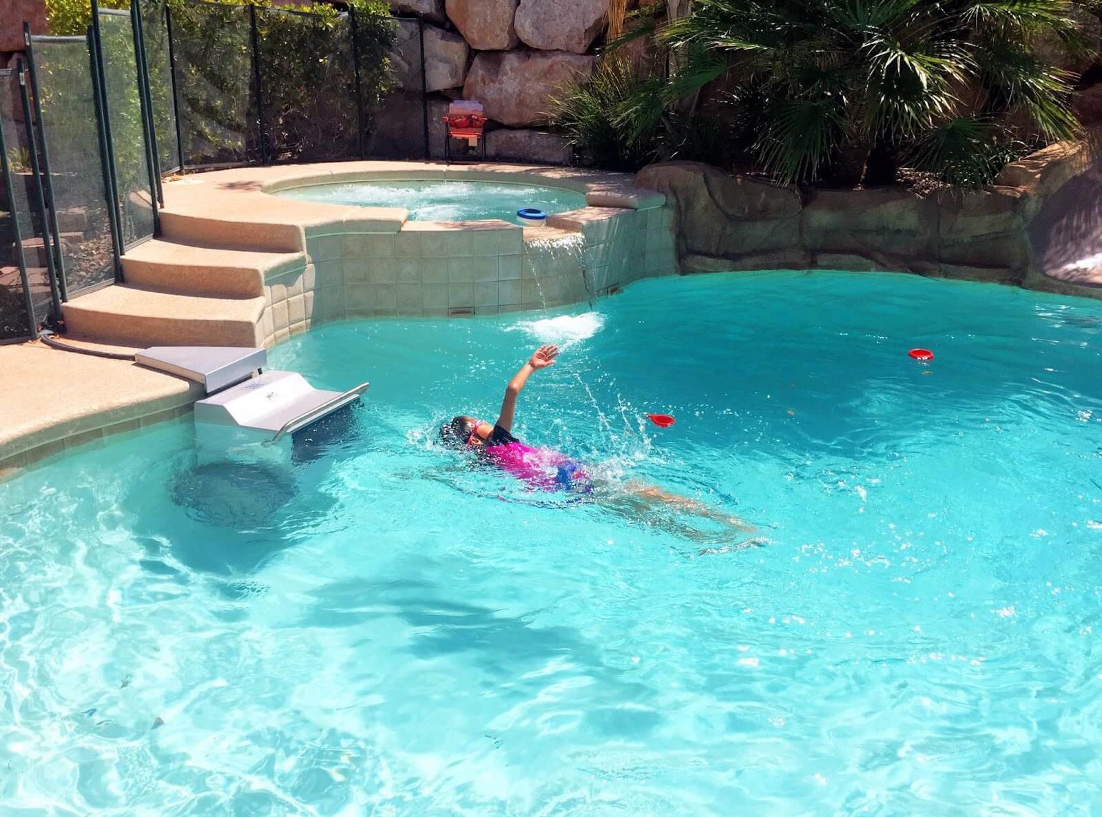 picture of girl swimming in the current of the Endless Pools Fastlane Pro system