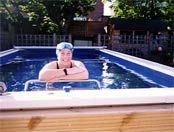 Open water swimmer Julie Bradshaw in the Endless Pools swimming machine in her garden